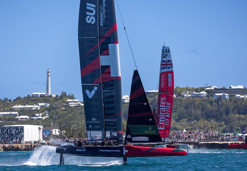 Switzerland SailGP Team helmed by Nathan Outteridge and Emirates Great Britain SailGP Team helmed by Giles Scott in action in front of the grandstand in the Race Stadium on Race Day 1 of the Apex Group Bermuda Sail Grand Prix in Bermuda - photo © Felix Diemer for SailGP