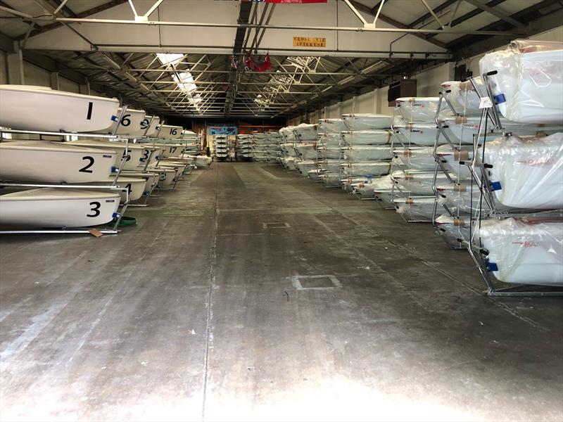 Lasers (on the right rear) stacked and waiting for competitors at the Youth Worlds in Poland. LPE and the other two builders supply boats on a charter basis for major Laser regattas - photo © Laser Performance Europe