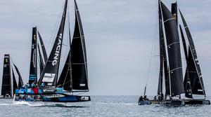 Day 3 – Movistar-Ventana Group charges through the fleet in a big gust – GC32 Villasimius Cup photo copyright Jesus Renedo / GC32 Racing Tour taken at  and featuring the  class